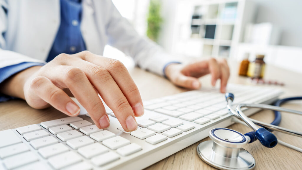 Clinical researcher at computer
